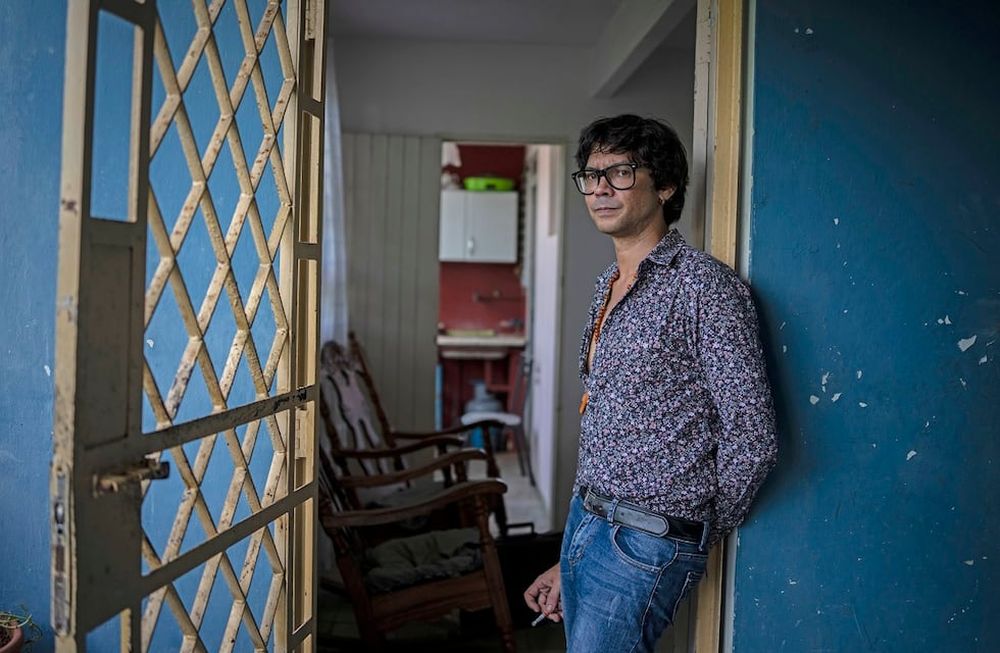 Yunior Garcia Aguilera, a playwright and one of the organizers of a protest march set for Monday, poses for a photo during an interview with The Associated Press at his home in Havana, Cuba, Friday, Nov 12, 2021. (AP Photo/Ramon Espinosa)