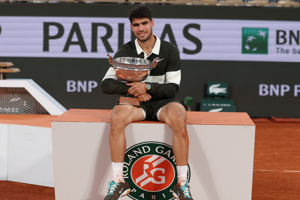 Carlos Alcaraz of Spain celebrates with the Coupe des Mousquetaires after winning his Mens final match against Jannik Sinner of Italy at the French Open Grand Slam tennis tournament at Roland Garros in Paris, France, 08 June 2025. (Tenis, Abierto, Francia, Italia, España) EFE/EPA/MOHAMMED BADRA
