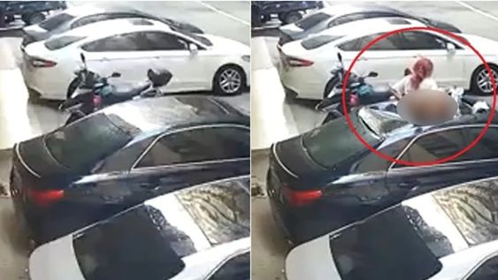 Las cámaras de seguridad del edificio capturaron el momento exacto en el que la mujer cae sobre el techo de un vehículo estacionado y afortunadamente sobrevive.