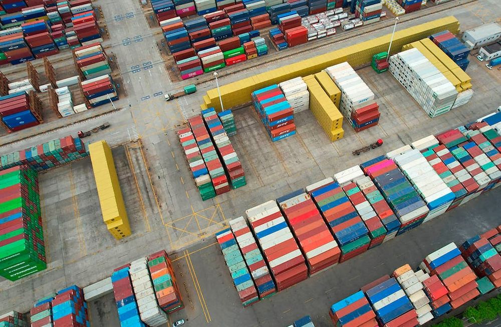 This aerial photo shows cargo containers stacked at a port in Lianyungang in Chinas eastern Jiangsu province on May 9, 2022. Chinas export growth slumped in April to its lowest level in almost two years, customs data showed on May 9, as a Covid resurgence shuttered factories, sparked transport curbs and caused congestion at key ports. - China OUT (Photo by AFP)
