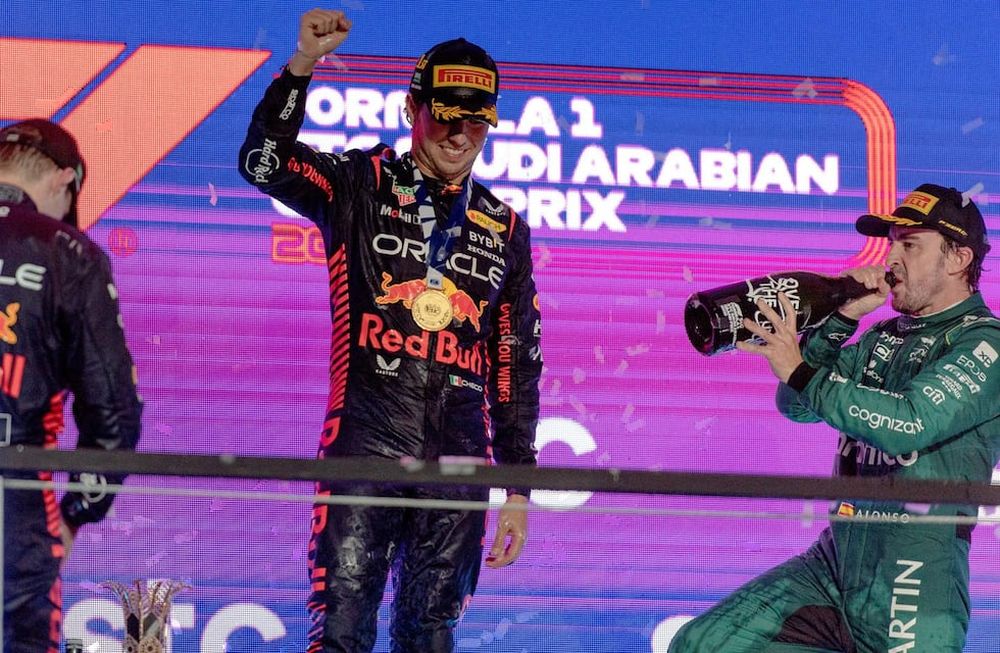 Jeddah (Saudi Arabia), 19/03/2023.- Winner Mexican driver Sergio Perez (C) of Red Bull Racing, second placed Dutch driver Max Verstappen (L) of Red Bull Racing and third placed Spanish driver Fernando Alonso of Aston Martin during the podium ceremony for the Formula One Grand Prix of Saudi Arabia at the Jeddah Corniche Circuit, Saudi Arabia, 19 March 2023. (Fórmula Uno, Arabia Saudita) EFE/EPA/STR