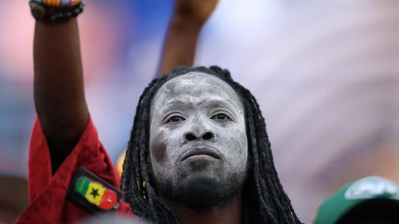 Su nombre real es Stephen Osei Mensah, un ciudadano ghanés, quien nació en la región de Ashanti en 1973. Fue víctima de una explosión de gas en su adolescencia, por lo que sufrió graves quemaduras en su cara y otras partes del cuerpo. Su nombre real es Stephen Osei Mensah, un ciudadano ghanés, quien nació en la región de Ashanti en 1973. Fue víctima de una explosión de gas en su adolescencia, por lo que sufrió graves quemaduras en su cara y otras partes del cuerpo.