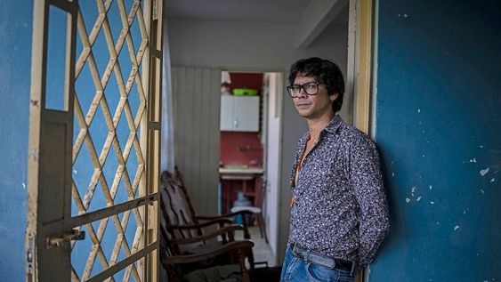 Yunior Garcia Aguilera, a playwright and one of the organizers of a protest march set for Monday, poses for a photo during an interview with The Associated Press at his home in Havana, Cuba, Friday, Nov 12, 2021. (AP Photo/Ramon Espinosa)