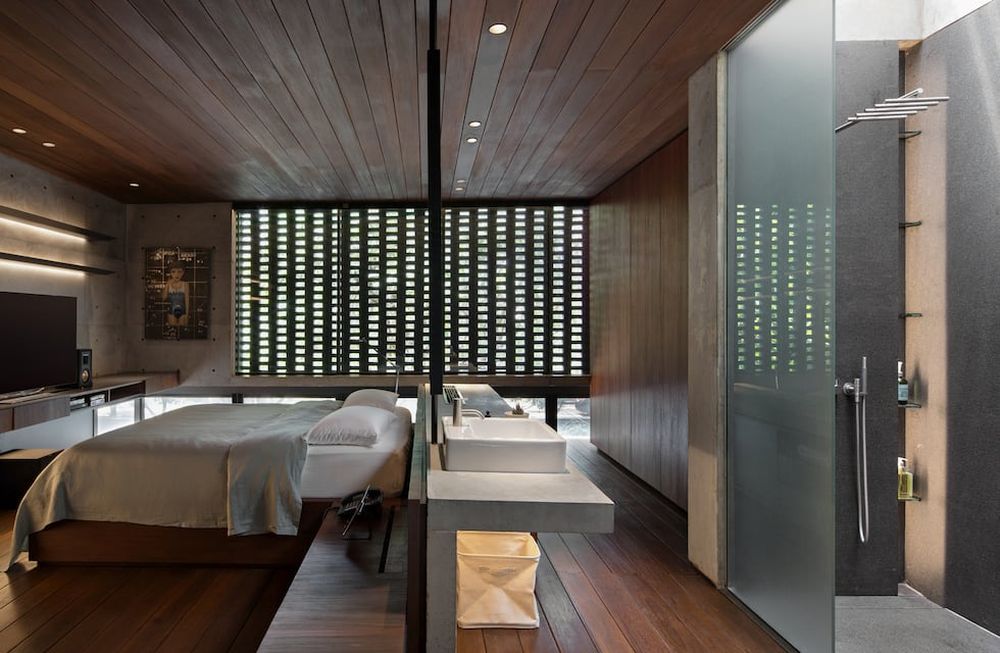 El baño detrás de la cama: 8 dormitorios con baños integrados