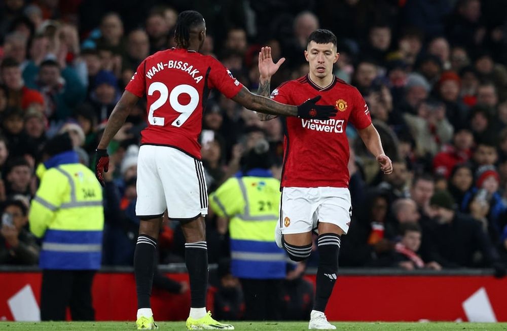 Manchester Uniteds Argentinian defender #06 Lisandro Martinez (R) comes on after several months off injured, during the English Premier League football match between Manchester United and Tottenham Hotspur at Old Trafford in Manchester, north west England, on January 14, 2024.