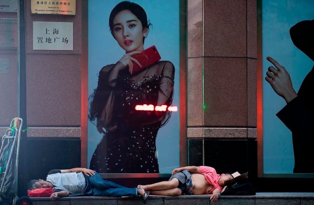 Fotogalería: cientos de chinos duermen en la calle por el insoportable calor