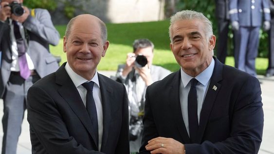 German Chancellor Olaf Scholz, left, welcomes Israeli Prime Minister Yair Lapid, right, for a meeting at the chancellery in Berlin, Germany, Monday, Sept. 12, 2022. (AP Photo/Michael Sohn)
