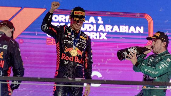 Jeddah (Saudi Arabia), 19/03/2023.- Winner Mexican driver Sergio Perez (C) of Red Bull Racing, second placed Dutch driver Max Verstappen (L) of Red Bull Racing and third placed Spanish driver Fernando Alonso of Aston Martin during the podium ceremony for the Formula One Grand Prix of Saudi Arabia at the Jeddah Corniche Circuit, Saudi Arabia, 19 March 2023. (Fórmula Uno, Arabia Saudita) EFE/EPA/STR