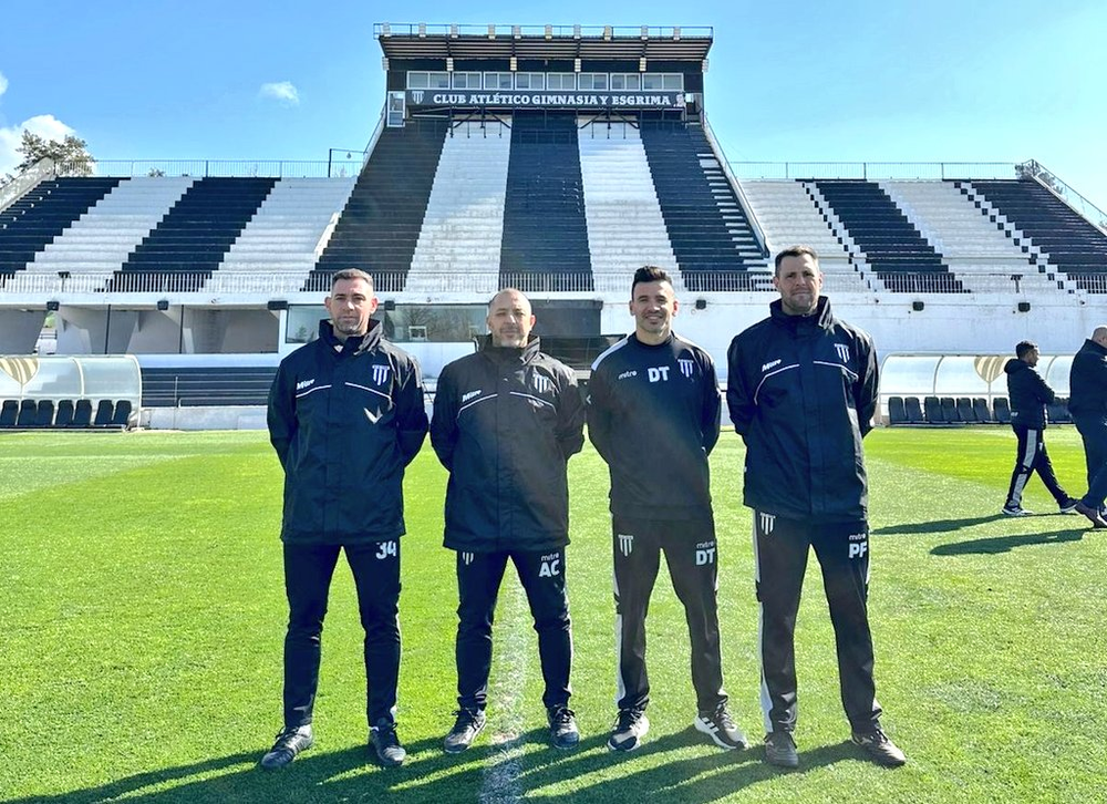 The brand new Lobo coach with his coaching staff.