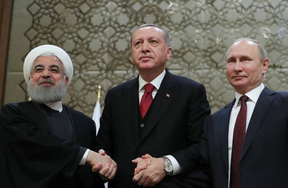 El presidente iraní, Hasan Rohaní, y sus homólogos turco, Recep Tayyip Erdogan, y ruso, Vladímir Putin.