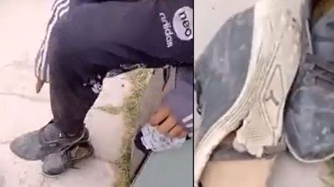 Vio que un niño tenía las zapatillas rotas, se sacó las suyas y se las regaló. / Foto: Captura de video