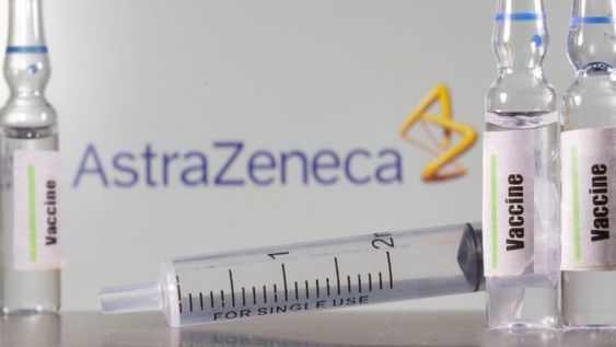 A test tube labelled with the Vaccine is seen in front of AstraZeneca logo in this illustration taken, September 9, 2020\u002E REUTERS/Dado Ruvic/Illustration