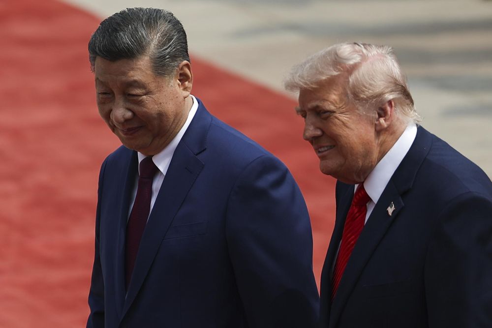 Donald Trump junto a Xi Jinping