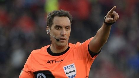 Referee Fernando Rapallini gestures during the Argentine Superliga first division football match between River Plate and Boca Juniors at the \